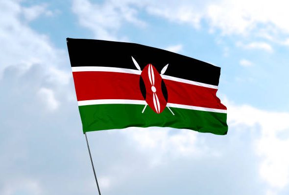 Flag of Kenya in front of the blue sky